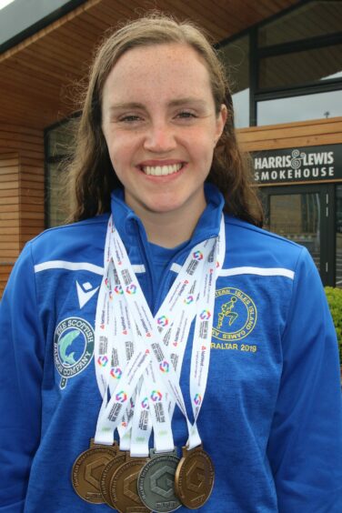 Kara Hanlon with her medals