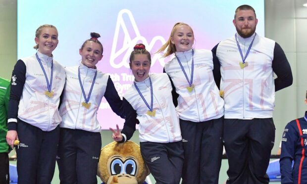 Kim Beattie, second from left, on the podium with her GB teammates after winning gold. (Photo supplied by British Gymnastics)