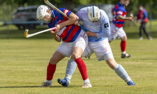 Roddy Young (Kingussie) with Liam Symonds (Caberfeidh).  Image: Neil Paterson.