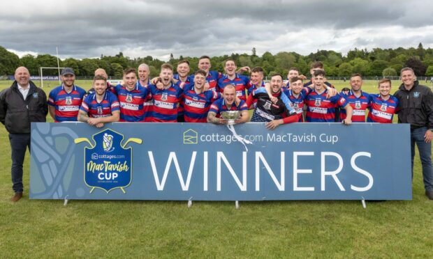 The victorious KIngussie team last season with the MacTavish Cup. Image: Neil G Paterson