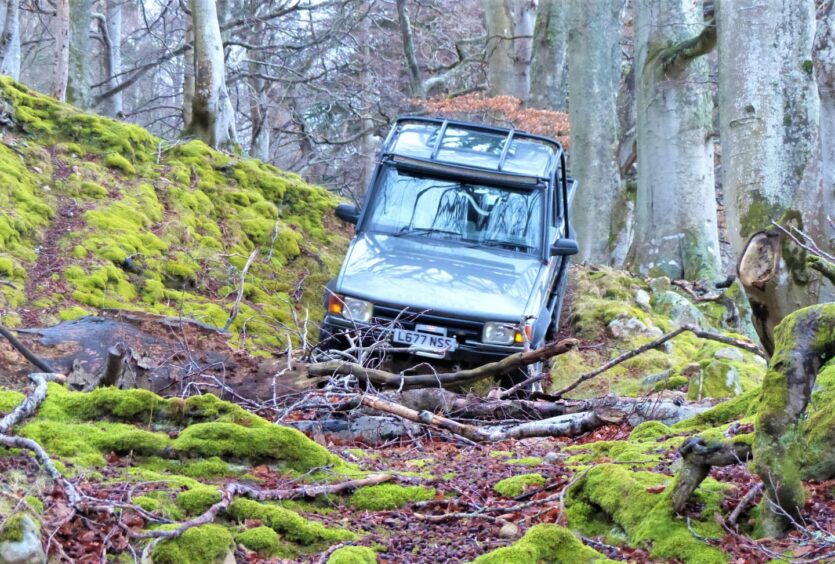 A car on very uneven terrain.