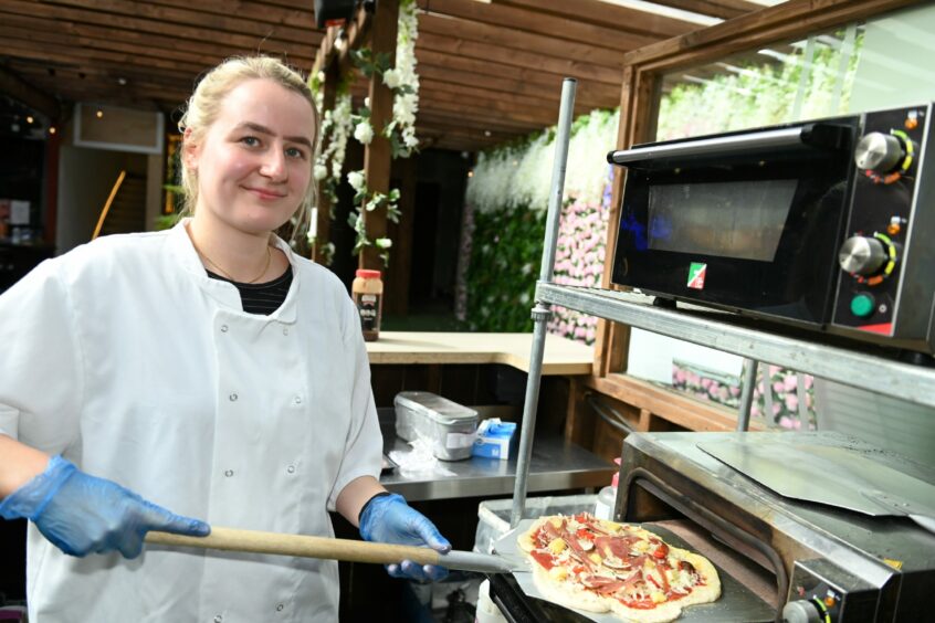 Chef Ayshia letting the pizza oven work its magic.