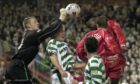 Eugene Dadi  takes on keeper Robert Douglas at Pittodrie in a 2-0 loss in February 2002.
