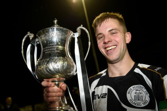 Wick Academy captain Alan Farquhar, pictured with the North of Scotland Cup, has his testimonial tomorrow