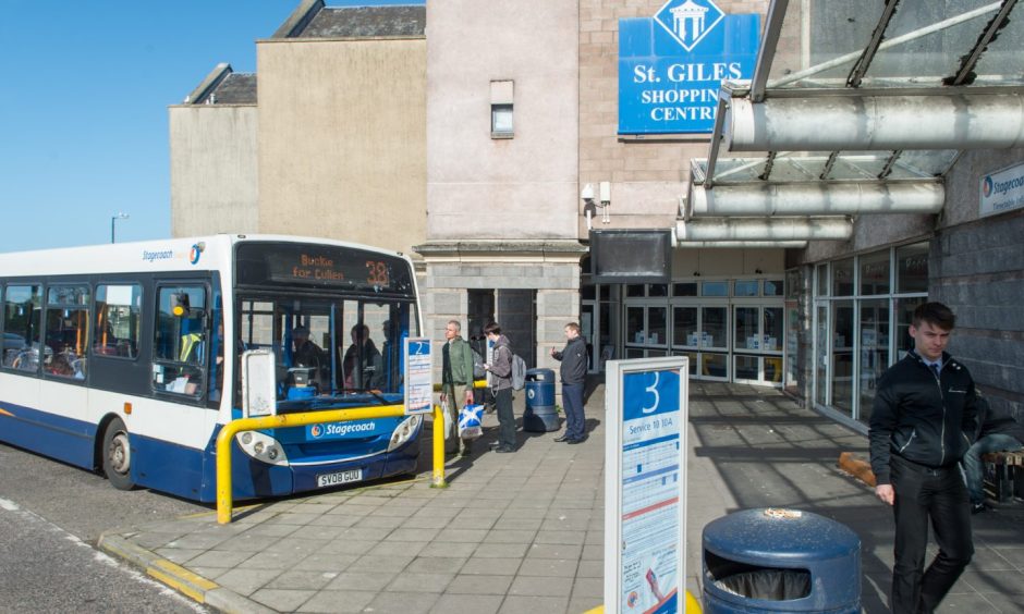 Passengers boarding bus at Elgin bus station. 