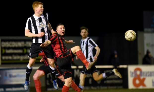 Defender Owen Cairns, left, in action for Fraserburgh against Inverurie Locos' Ryan Stott in 2020.