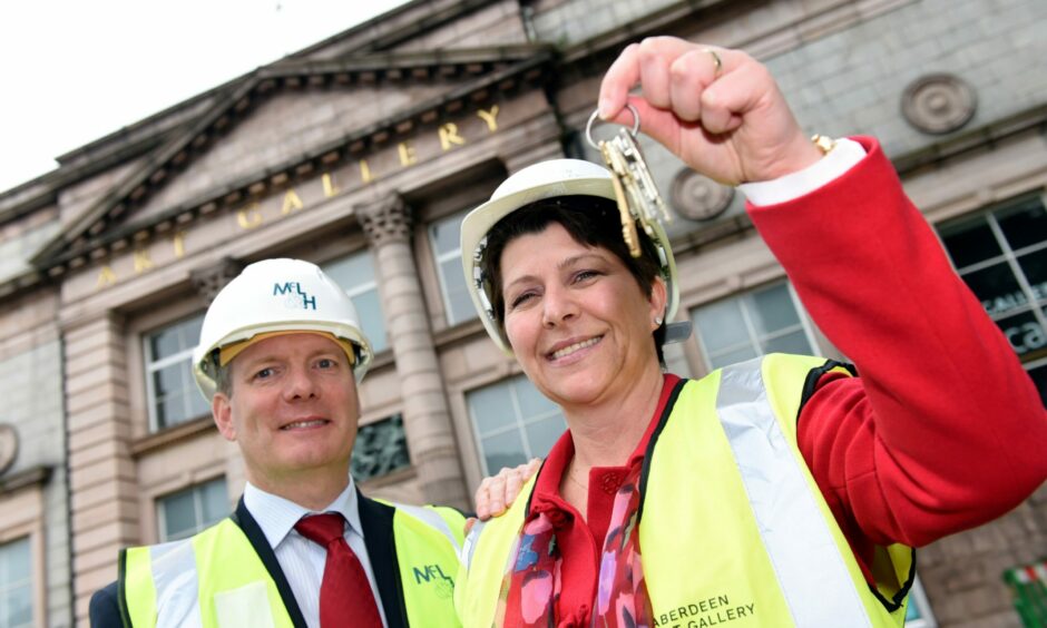 July 2015: Then deputy council leader Marie Boulton hands McLaughlin and Harvey director Michael Kieran the keys to Aberdeen Art Gallery ahead of work starting. Picture by Kami Thomson/DCT Media.