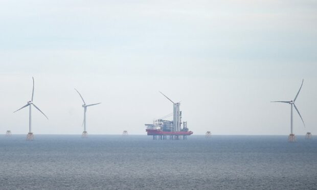 Wind turbines for the Moray East Wind Farm nearby the proposed new Moray West project spotted off the Caithness Coast. Picture by SANDY McCOOK 