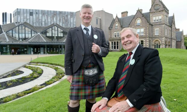 Iain MacFadyen (right) has been awarded a BEM for his services to piping. Picture by Sandy McCook.