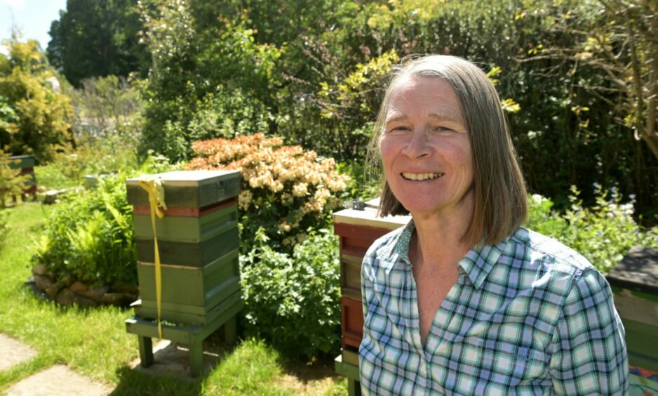 Beekeeper Ann Chilcott in her garden.
