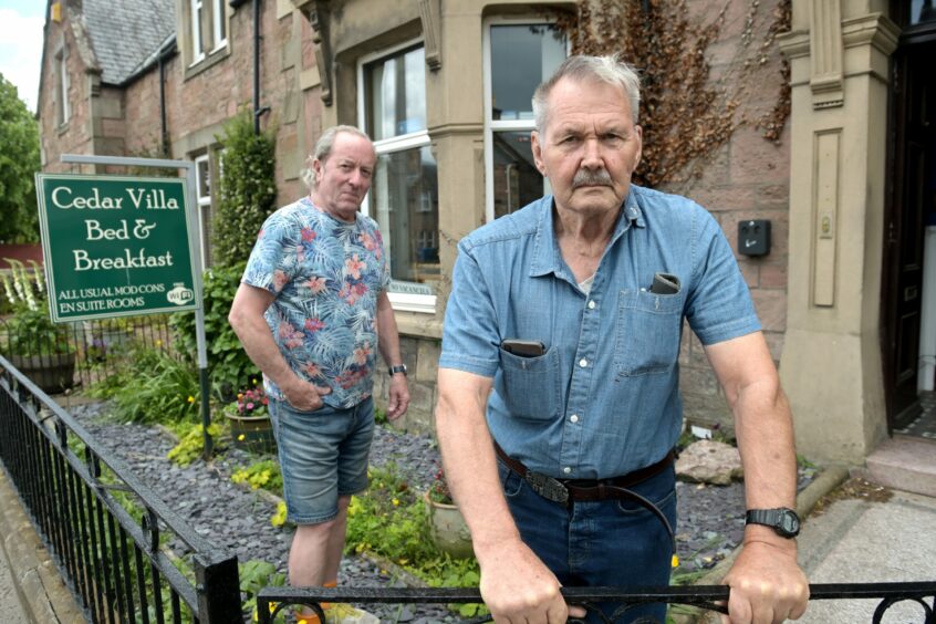 Larry Smith and Frank Eadie outside the guest house