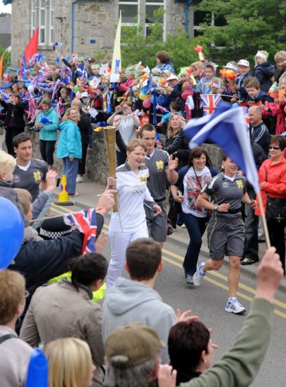 Olympic torch bearer Abigail O Grady being cheered by the pupils of Grantown and Aberneth primary schools in 2012.