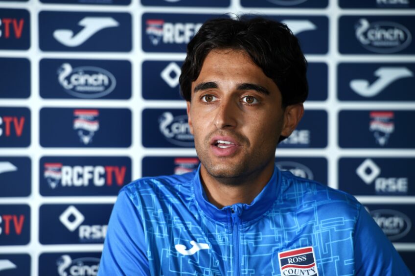 Yan Dhanda addresses the media at Ross County.