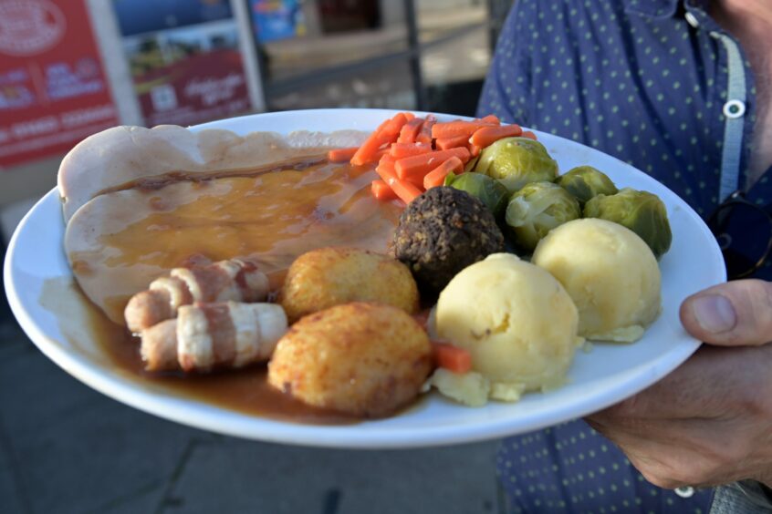 The Christmas Dinner includes, turkey roast potatoes, pigs in blankets, haggis, Brussel sprouts, carrots and gravy..