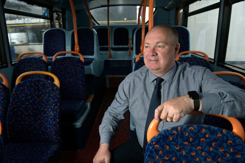 Stagecoach managing director David Beaton on board a bus.