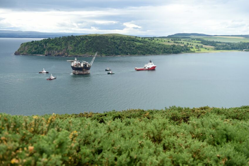 The Sevan Hummingbird FPSO is brought in to the Cromarty Firth yesterday (Wed) morning by the tug, Sien Ruby passing the village of Cromarty on its way.