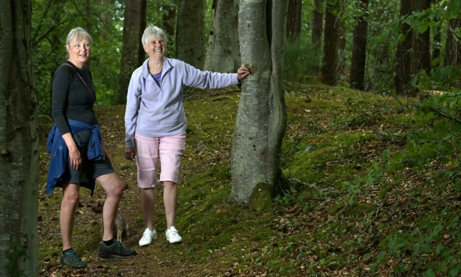 Caroline Phillips and Irene Stacey of the Culduthel Woods Group in the woodland.