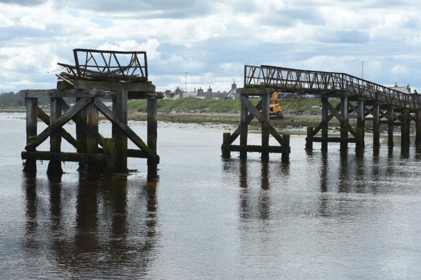 The old 100-years-old Lossiemouth bridge with sections missing mid-deconstruction