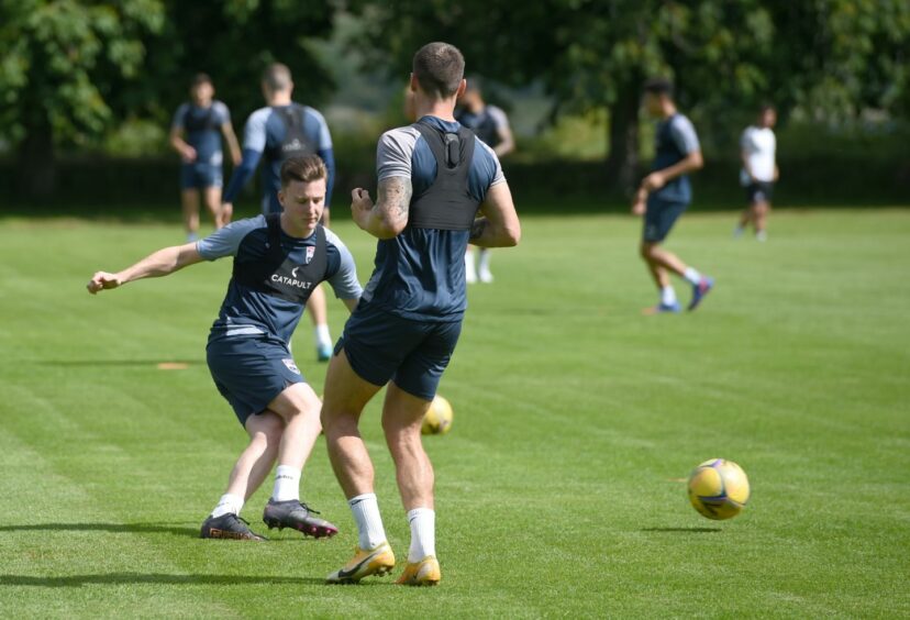 Ross County defender George Harmon, left, at training last week in Dingwall.
