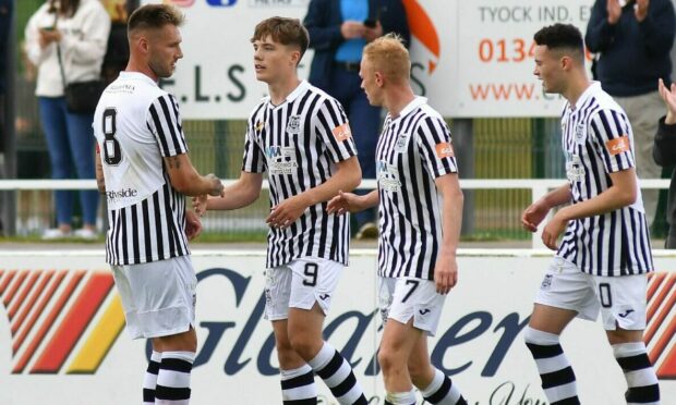 Elgin's Fin Allen (number 9) celebrates after opening the scoring against Peterhead.