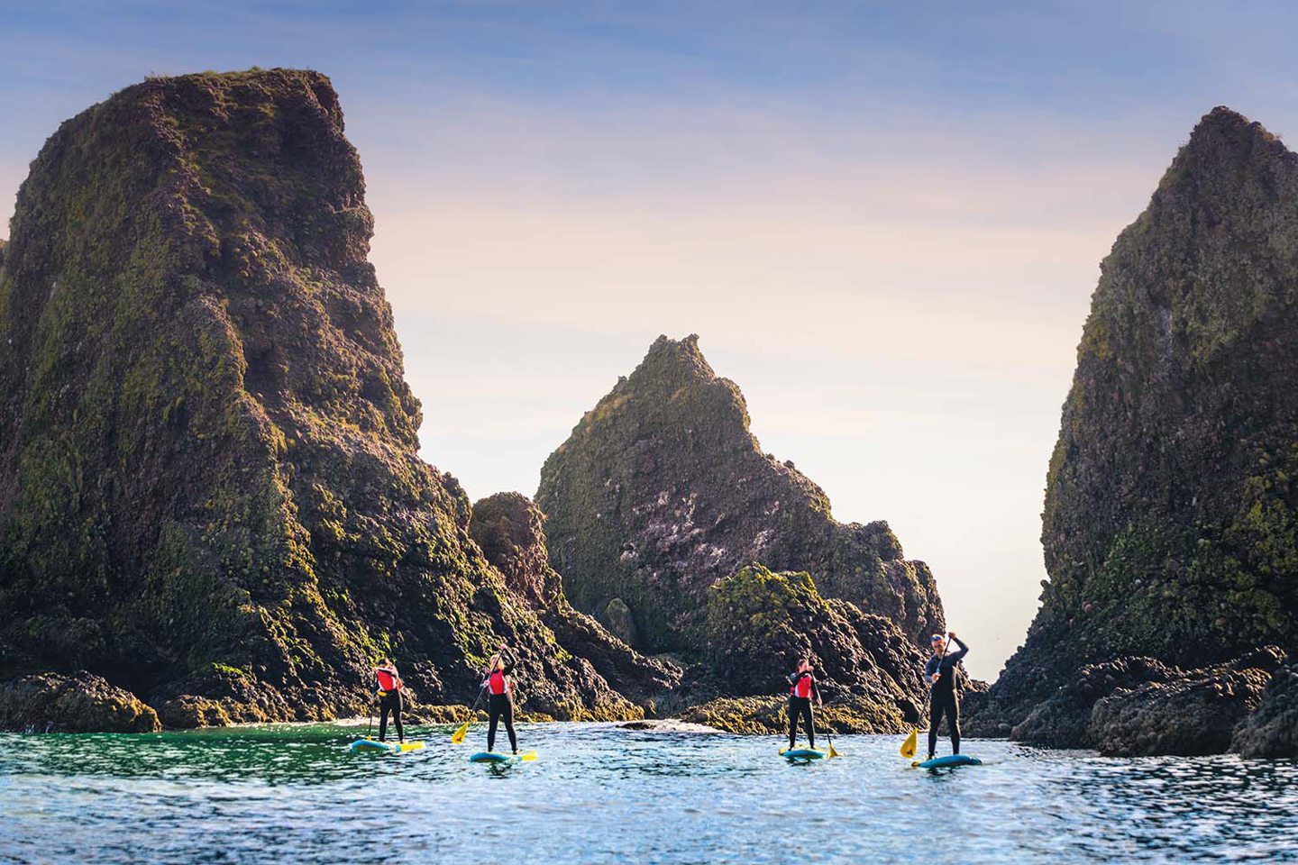 Group of people surfing and enjoying family days out in Aberdeenshire.