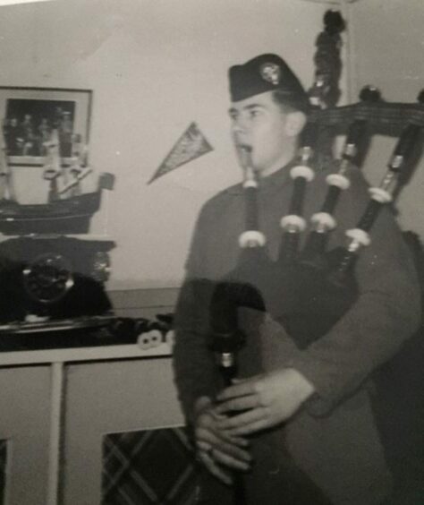 Pipe Major James Riddell playing the bagpipes