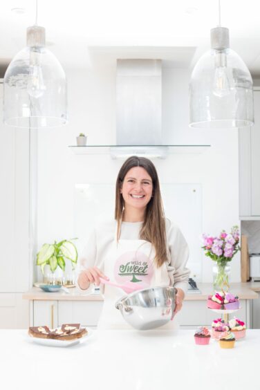 Jemma at work in her home kitchen.