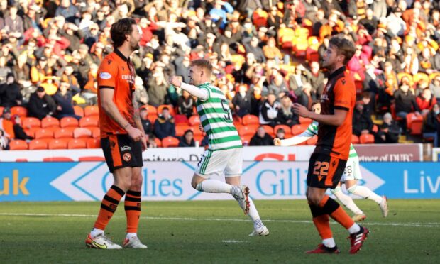 Celtic's Liam Scales celebrates scoring their side's third goal of the game during the cinch Premiership match at Tannadice Park, Dundee. Picture date: Sunday December 5, 2021. PA Photo. See PA story SOCCER Dundee Utd. Photo credit should read: Steve Welsh/PA Wire. 

RESTRICTIONS: Use subject to restrictions. Editorial use only, no commercial use without prior consent from rights holder.