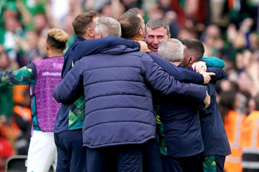 Republic of Ireland manager Stephen Kenny celebrates with his backroom staff after their third goal
