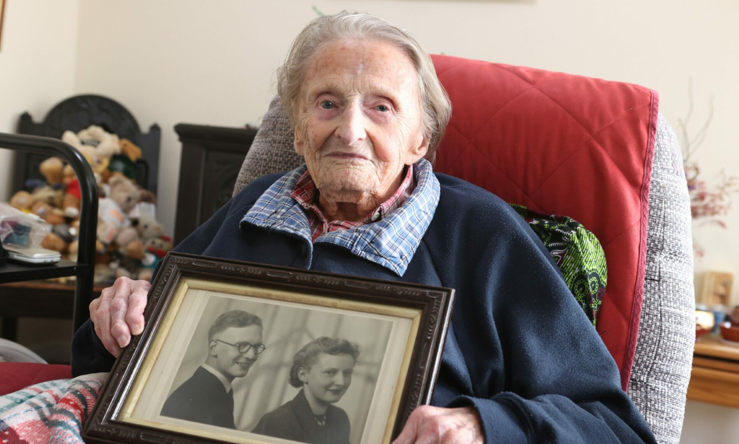 Shelagh Connor with a photograph of her and her late husband