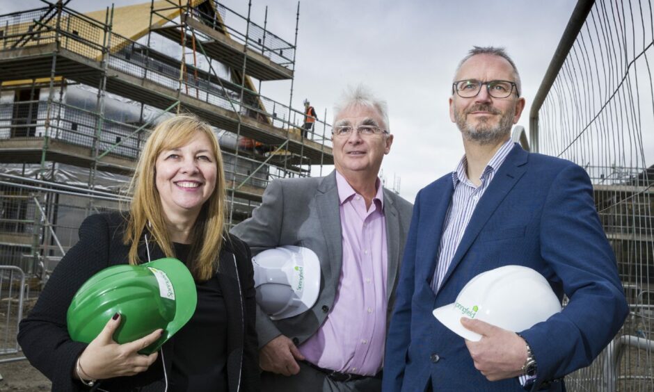 Springfield Properties chairman Sandy Adam, centre with chief executive Innes Smith and finance director Michelle Motion.