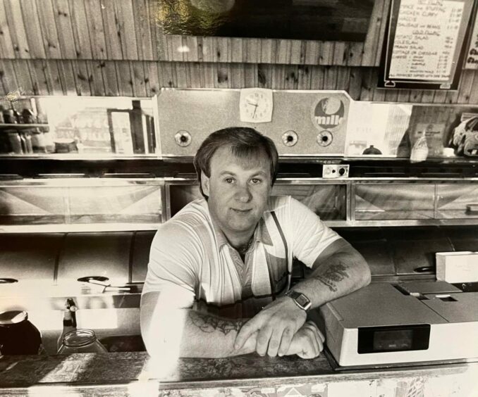 Stan behind the counter of his family chipper.
