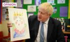Prime Minister Boris Johnson holds up a portrait he painted of the Queen during a drawing session with children (Photo: Daniel Leal/AP/Shutterstock)