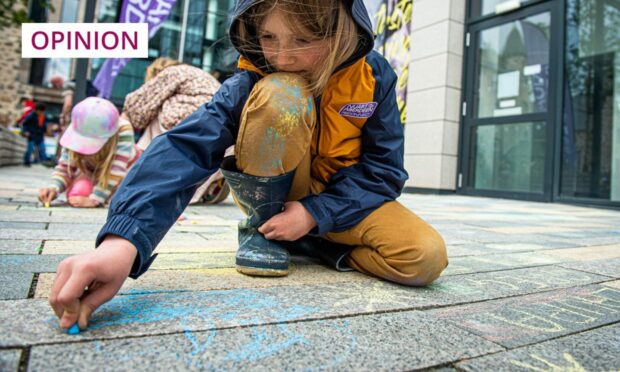 A young artist at work, during Nuart's Chalk Don't Chalk event (Photo: Wullie Marr/DC Thomson)