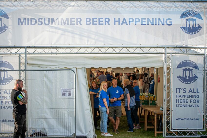 The Midsummer Beer Festival tent with the name of the event printed on the side in blue