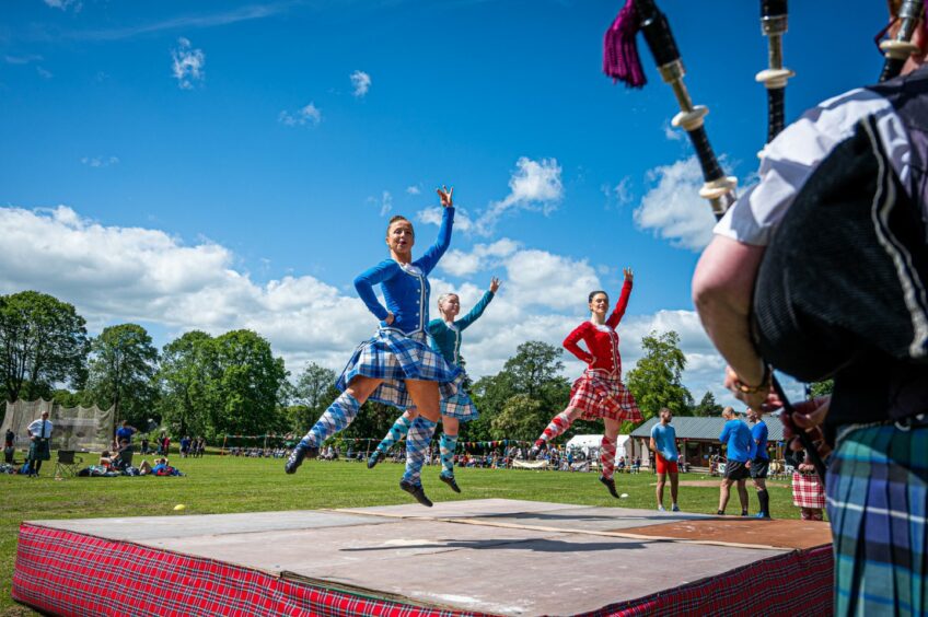 Highland dancers performing on a stage