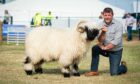 Raymond Irvine with his champion Valais Blacknose at the Royal Highland Show in 2022. Picture by Wullie Marr/DC Thomson