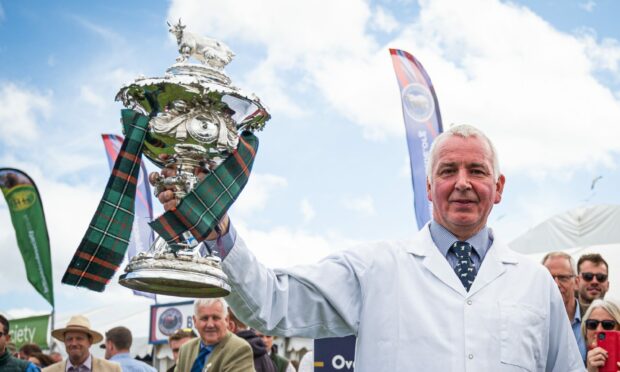 EMOTIONAL:  Andrew Reid wins the Royal Highland Show's new beef interbreed trophy. Pictures: Wullie Marr.