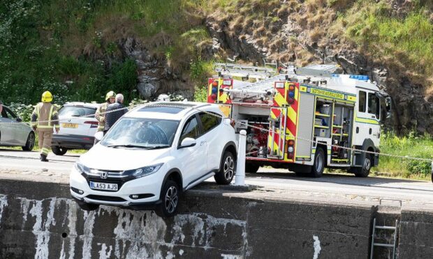 Car almost falls into Banff Harbour. Supplied by John Carroll.