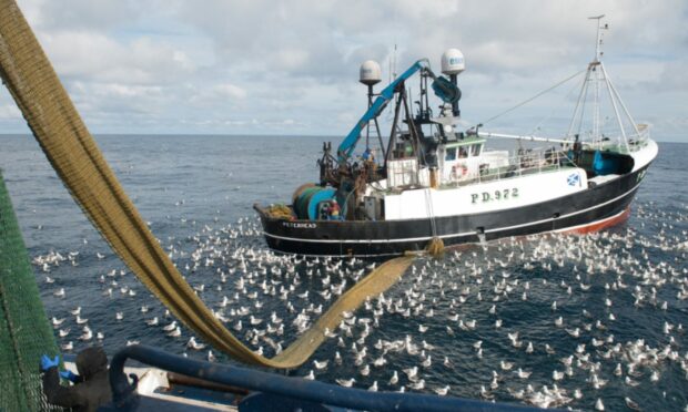 Peterhead fishing boat trawling at sea.