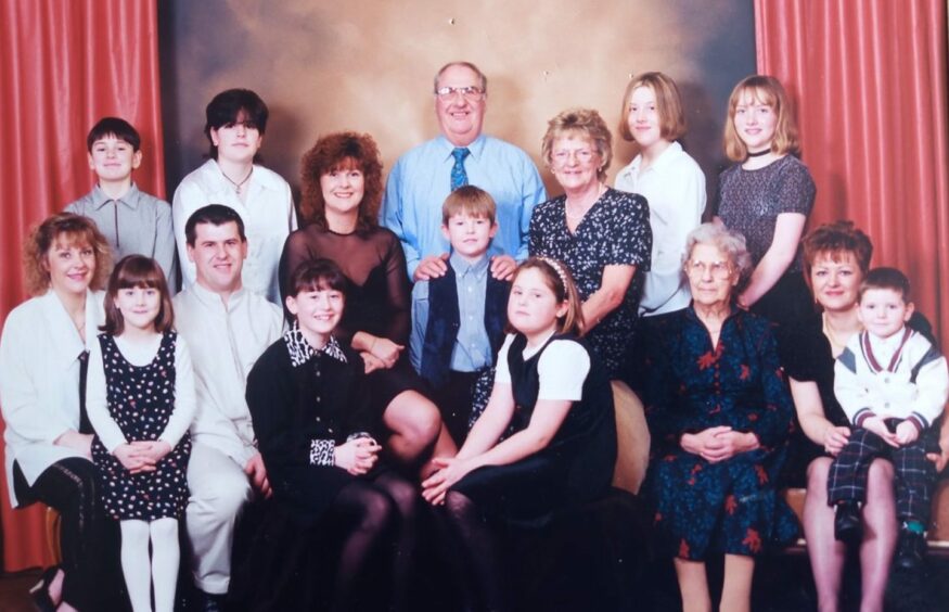 Harry Duncan in a photograph with the growing family he was so proud of.