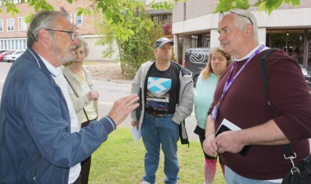 Protestor speaking to Highland Council leader Raymond Bremner.