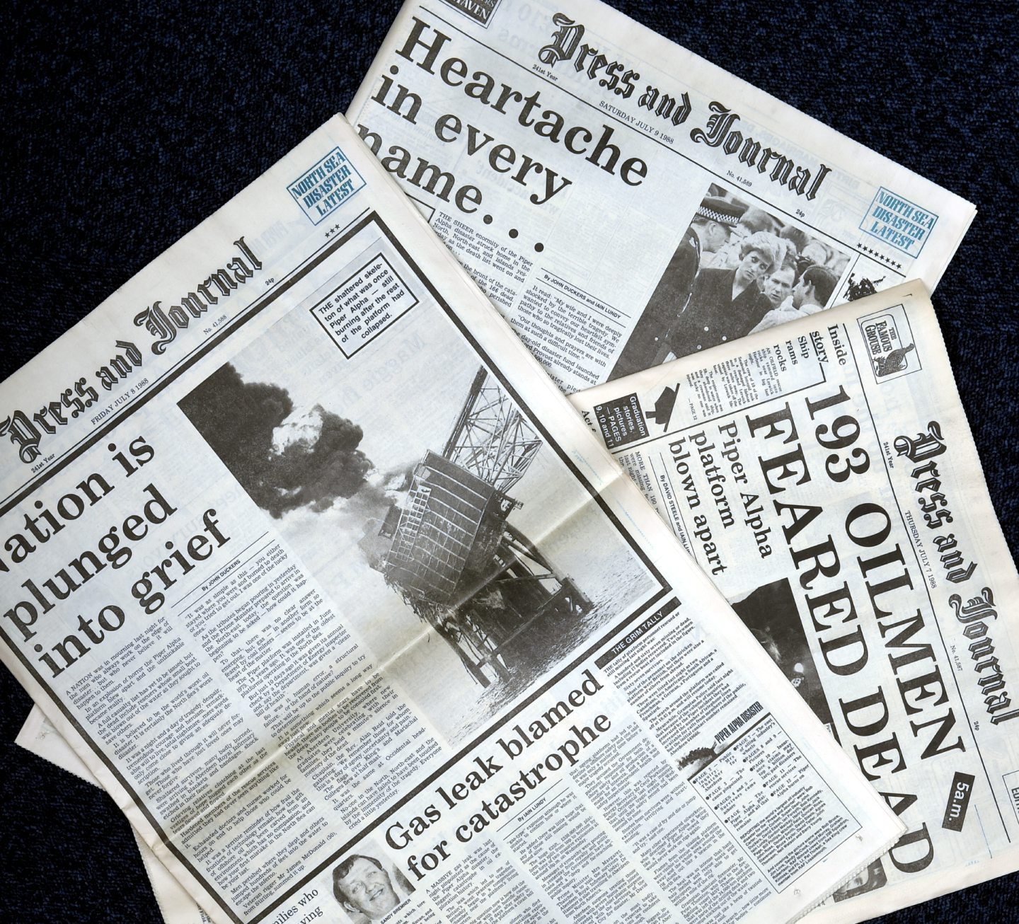 Copies of the Press and Journal, reporting on the 1988 story of the Piper Alpha platform in the north sea. In the picture are front page pages on Thursday the 7th, Friday the 8th of July and Saturday the 9th of July.