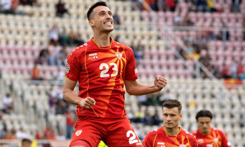 Bojan Miovski celebrates after scoring for North Macedonia against Gibraltar.