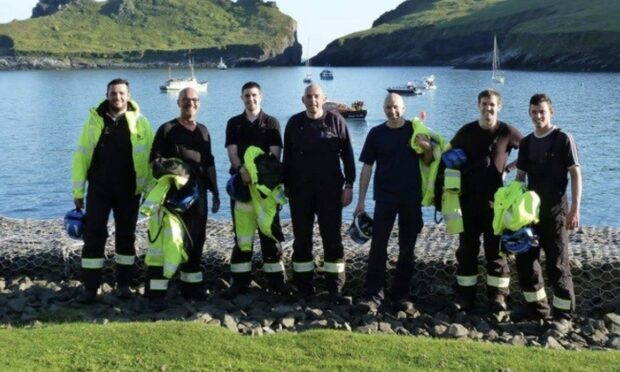 Members of the Stornoway Coastguard crew after the St Kilda rescue. L-R: Mitch Thompson, Willie Campbell (Station Officer), Callum Taylor, Willie Clark (Deputy Station Officer), Ron Maclean (Duty Officer), Ali Macdonald, Nathan Harris. Photo: Willie Campbell