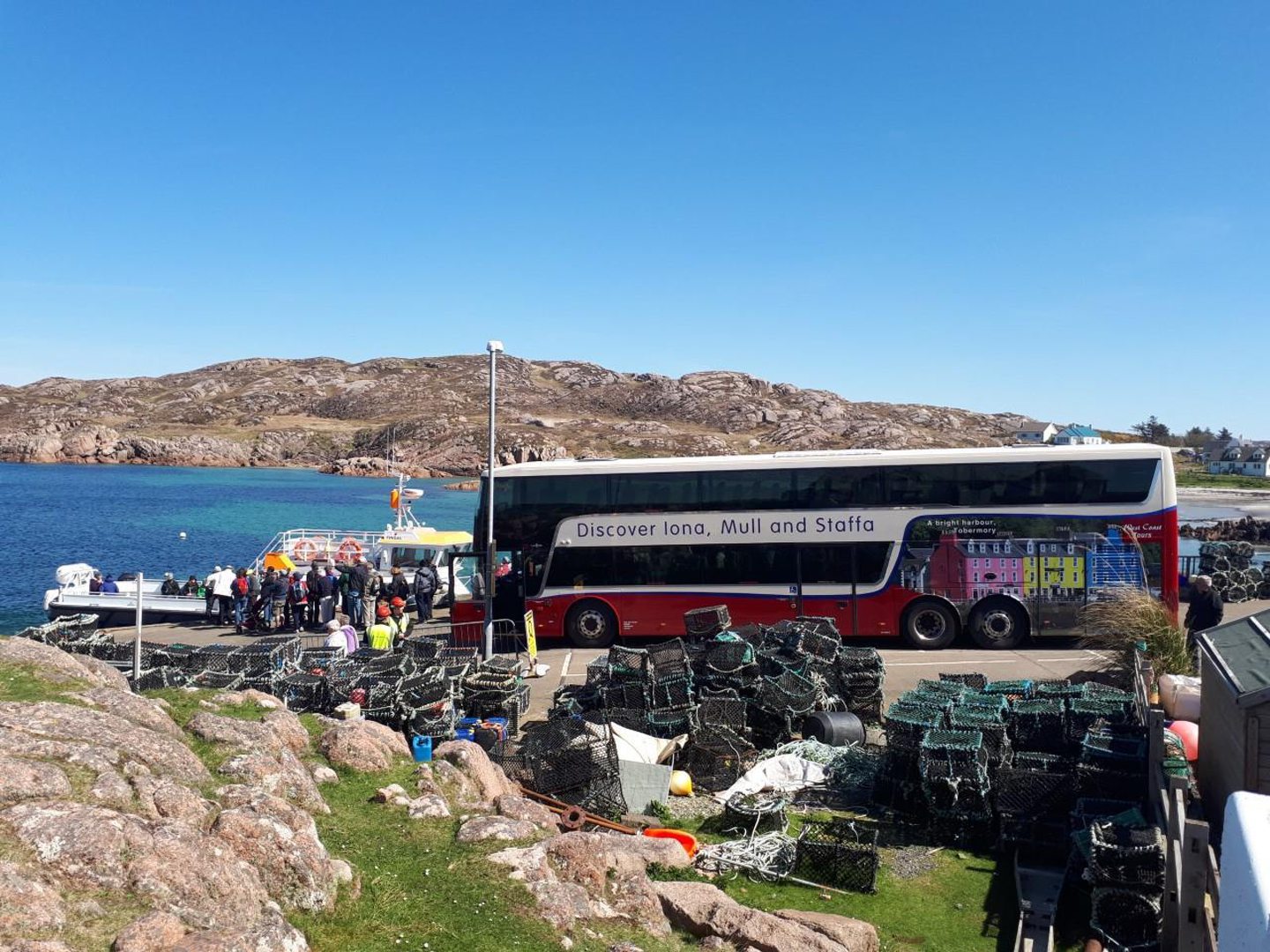 tourists board a West Coast Tours bus 
