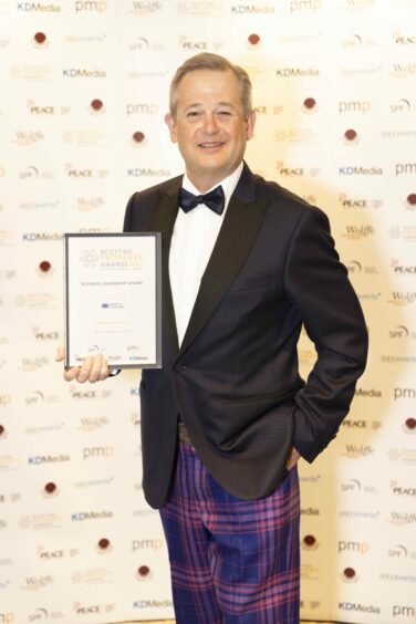 James Barrack with his business leadership award. 