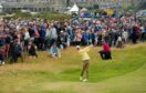 Rory McIlroy watched by the galleries in the first round at St Andrews.