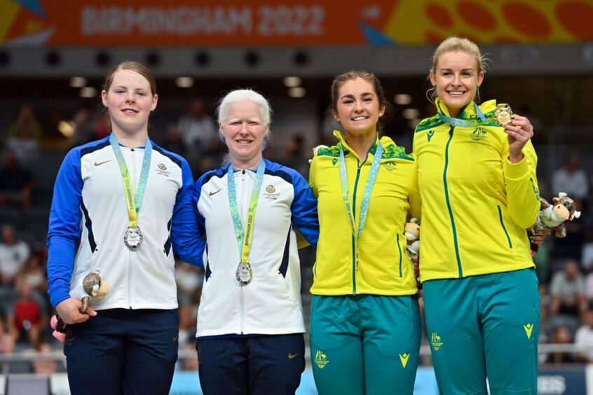 Ellie Stone, left, with Aileen McGlynn, second left, with their Commonwealth Games silver medals. Photo by Patrick Khachfe/JMP/Shutterstock (13056361au)