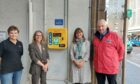 Pam Gowie, lead instructor from Lucky2BHere; Provost of Inverness, Glynis Sinclair; Jo Murray, manager of Inverness Victorian market and John Mcdonald, community safety manager for Inverness Bid unveiled the new defibrillator outside the Queensgate entrance of the Inverness Victorian Market.